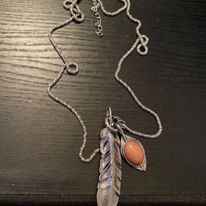 Feather Necklace With A Moon Stone Charm Attached On Sterling Silver